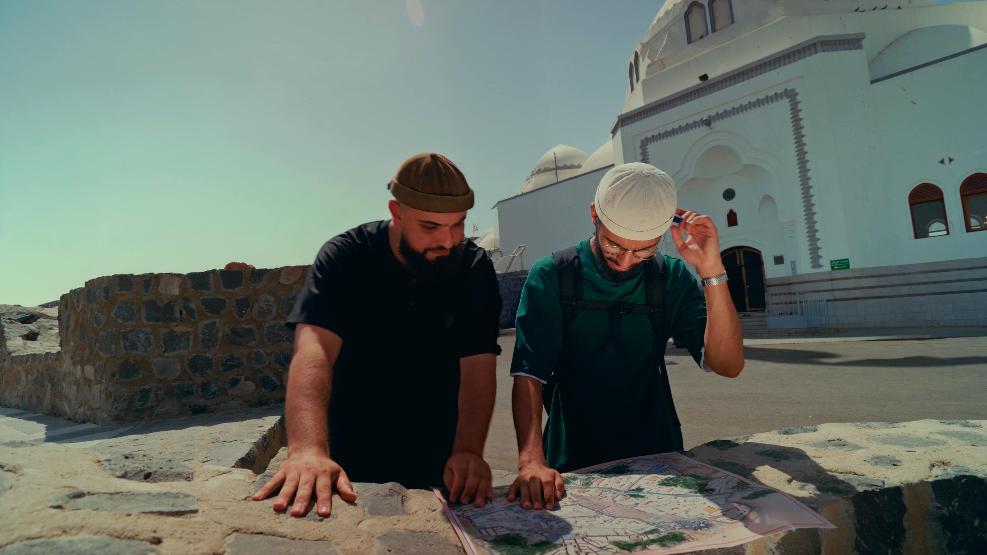 Sacred Chronicles filmmakers reading a map on location